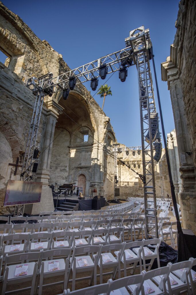 lighting and sound equipment getting set up for gala event