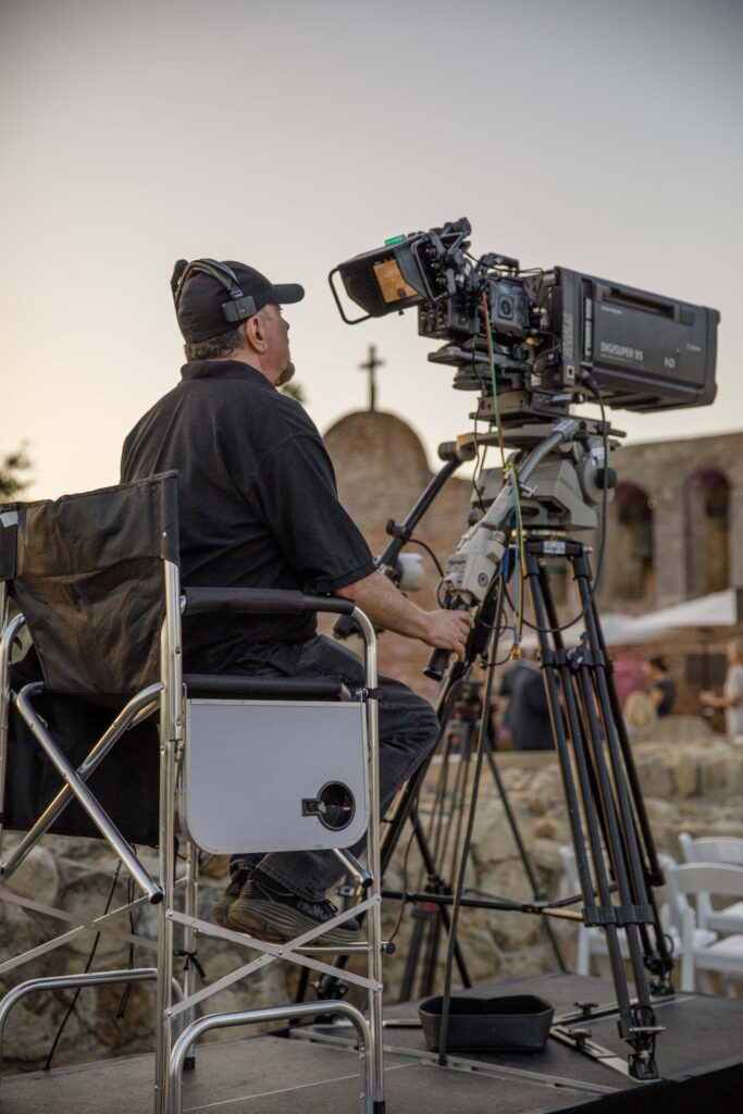 man sitting with camera