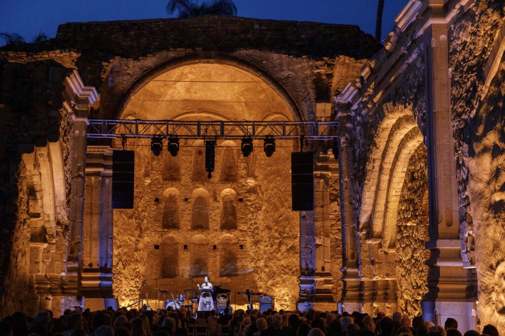 Mission San Juan Capistrano gala event with orange lighting