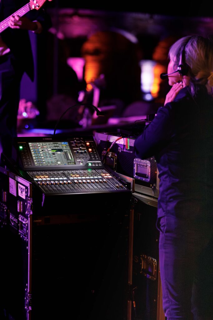 woman adjusting the audio and lighting
