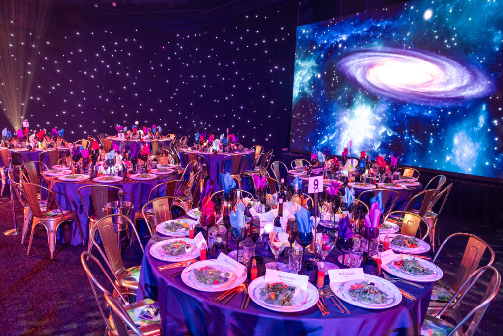 table decor and backdrops fit the intergalactic theme