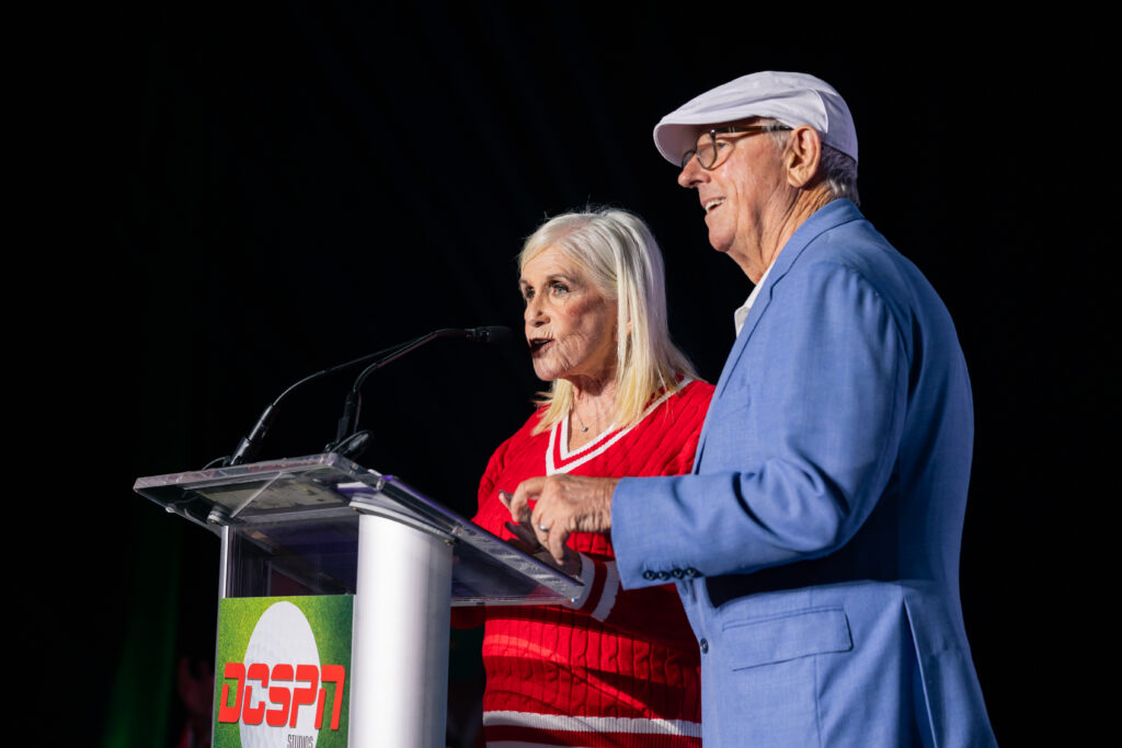 event speakers standing behind podium