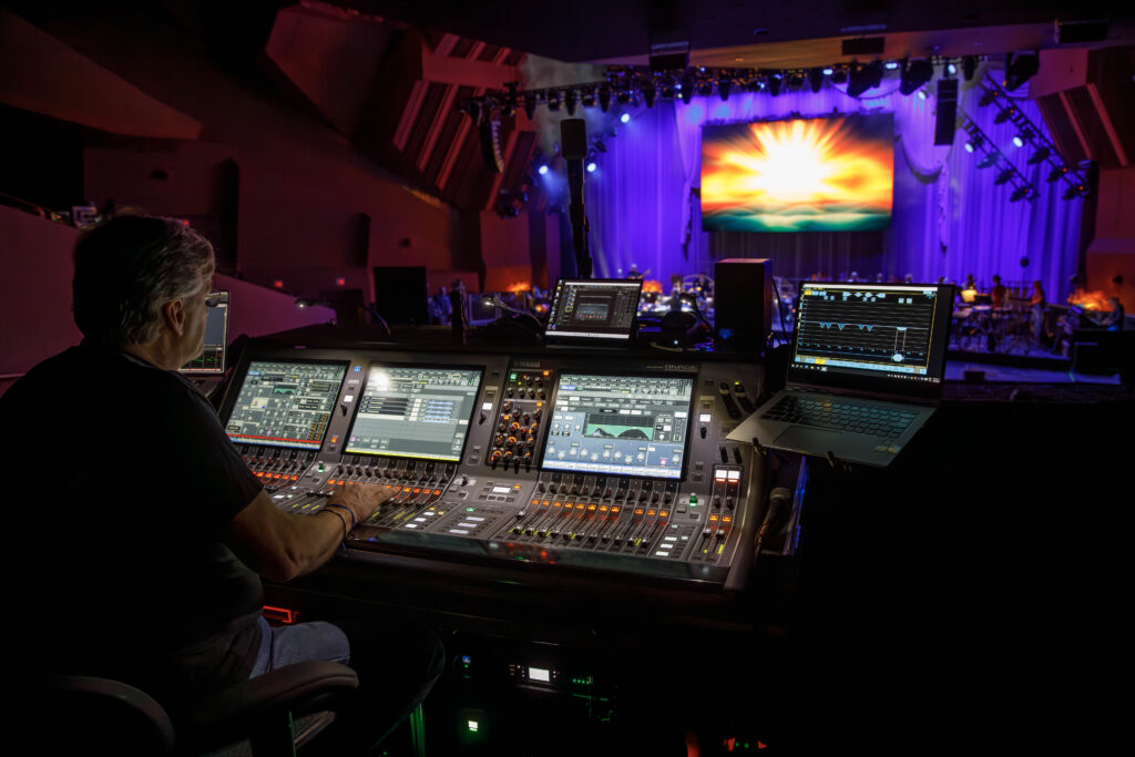 audio visual team working on lighting and sound for event