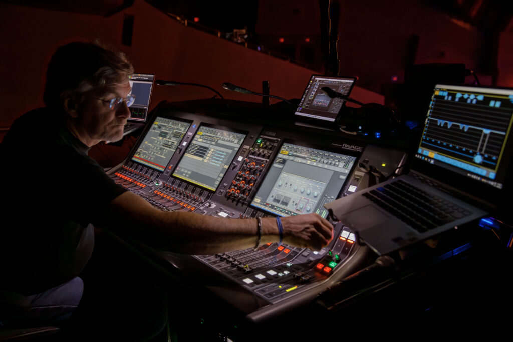 audio visual team working on lighting and sound for event