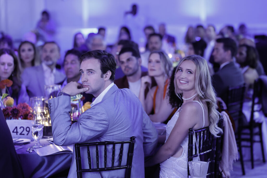 guests sitting for dinner at the fundraiser event