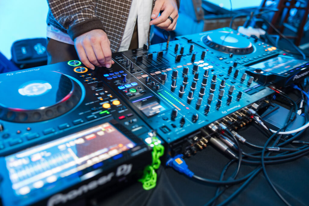 man working with equipment for audio and visual 