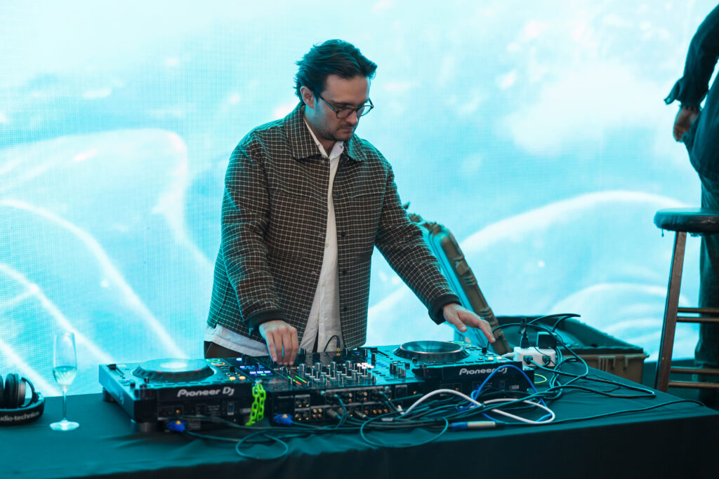 man working with equipment for audio and visual 