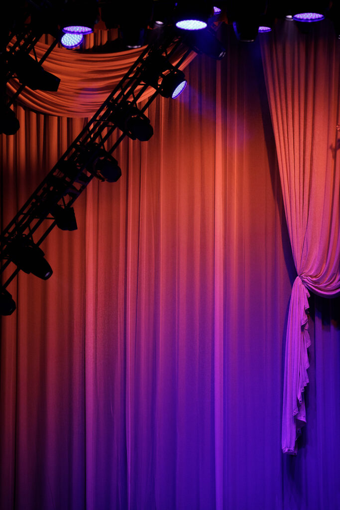 lighting equipment showing off various lights on curtain