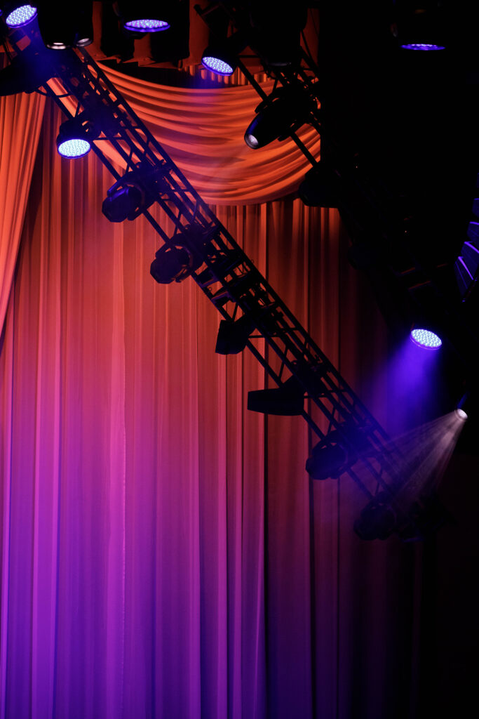 lighting equipment showing off various lights on curtain