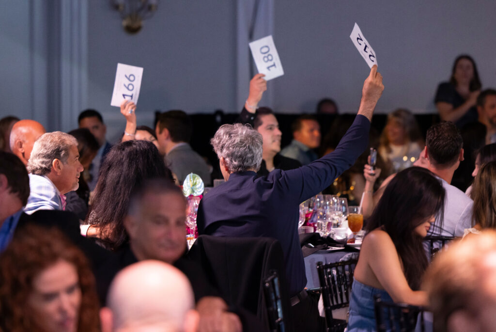 guests bidding on auction items 
