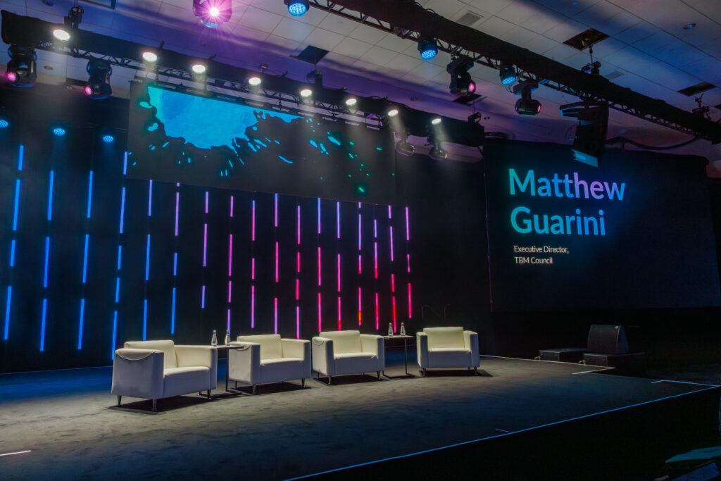 stage design and lighting for guest speaker at TBM Conference 2025
