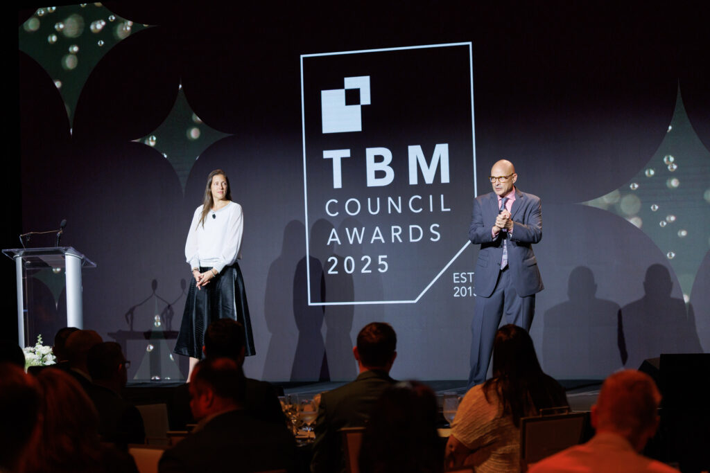 speakers on stage for awards ceremony