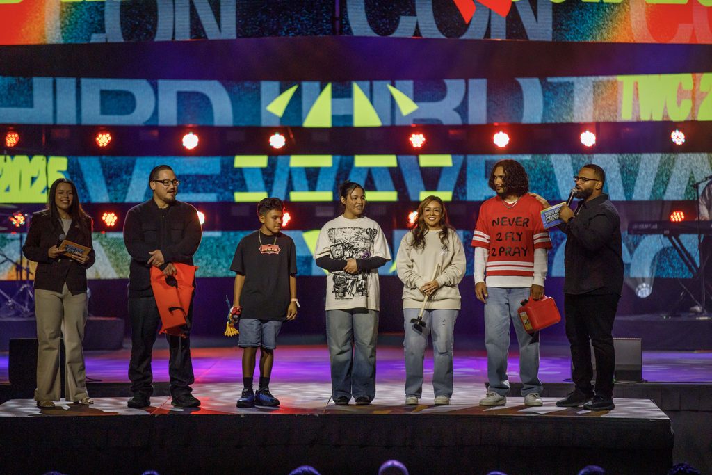 speaker with students on stage at live event