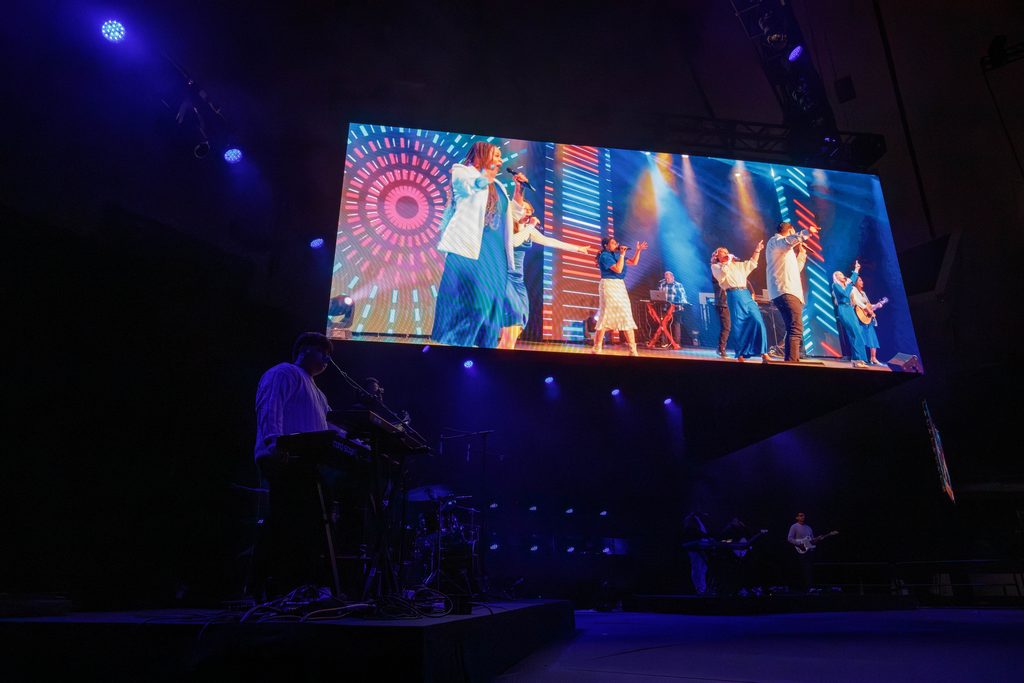 LED screen with live performers