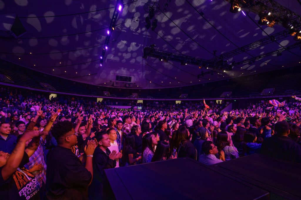 audience stands in front of stage at Anaheim Convention Center