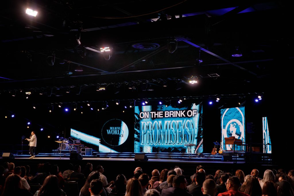 LED screens on stage with speaker at Anaheim Convention Center